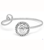 Silver bangle with flower shaped ends